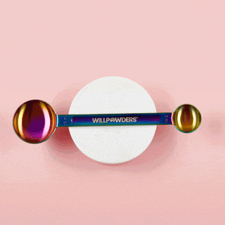 Rotating measuring scoop with WillPowders branding, on a pink background